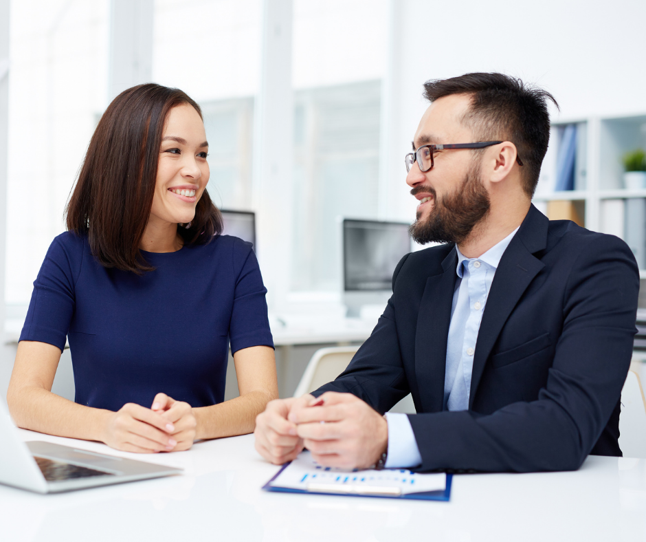 Business man and woman having a discussion at table